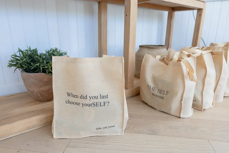 Canvas gift bags printed with “When did you last choose yourSELF?”