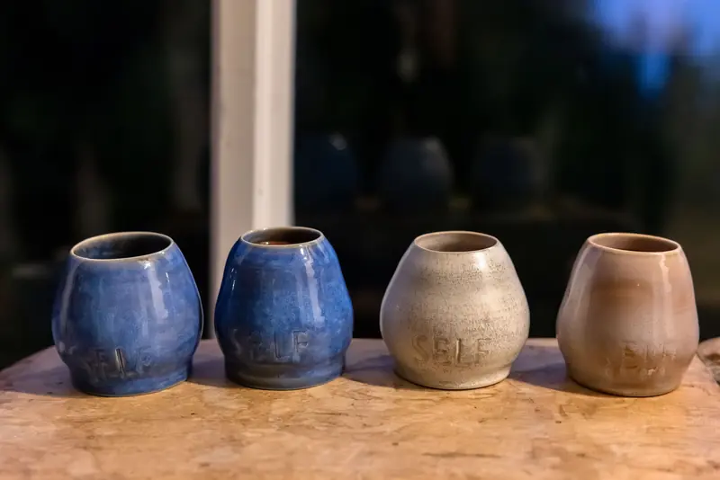 Ceramic cacao cups lined up at dusk