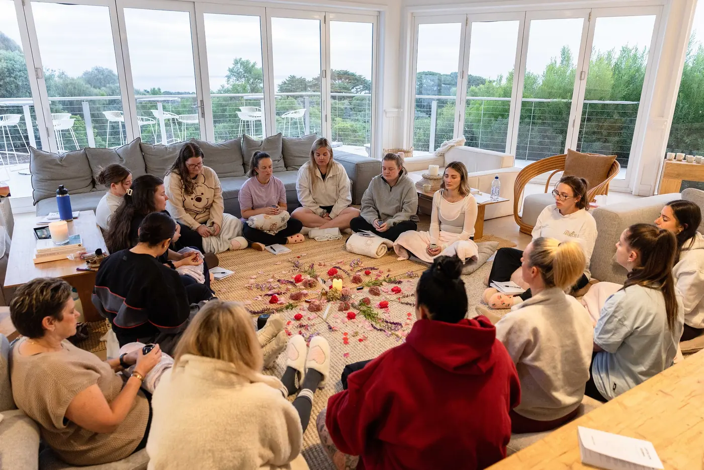 The closing circle on the floor around a carpet of rose petals, the windows full of trees