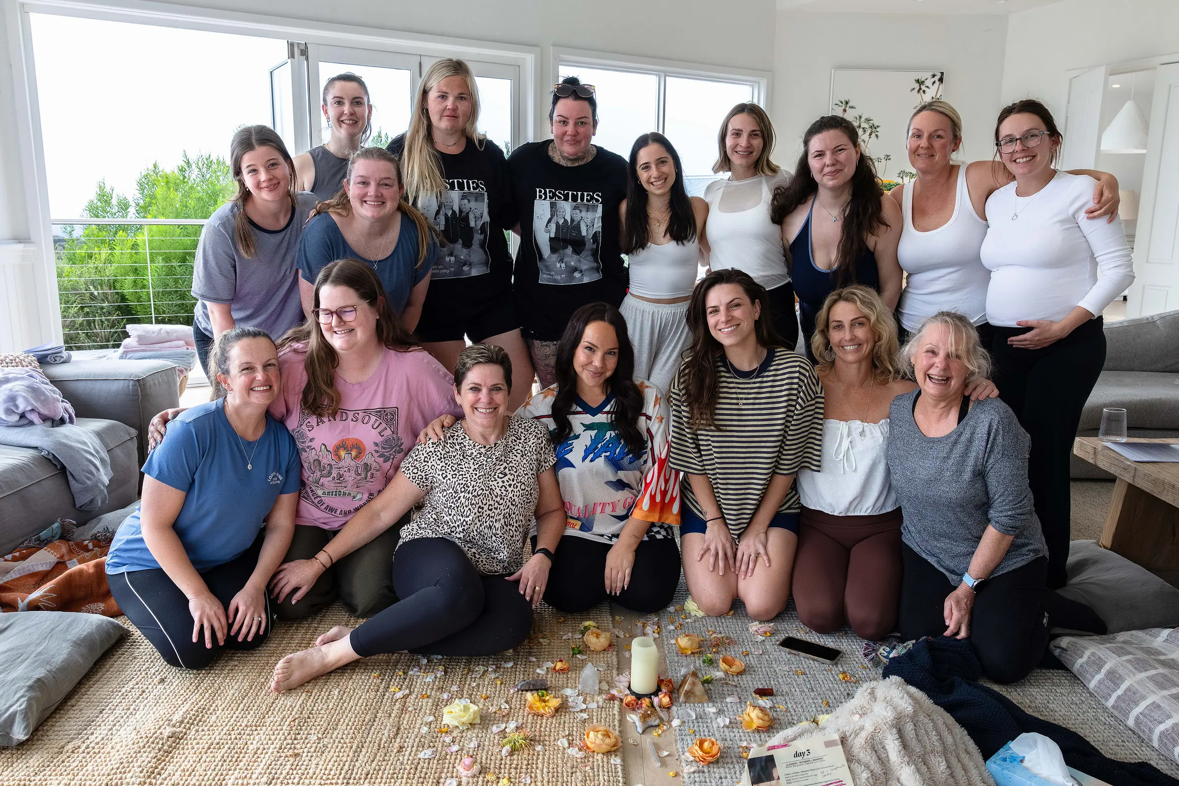 The March 2026 guests and the team together in the lounge room, smiling