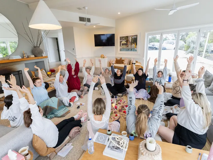 Arms up in the circle, on the lounge-room floor