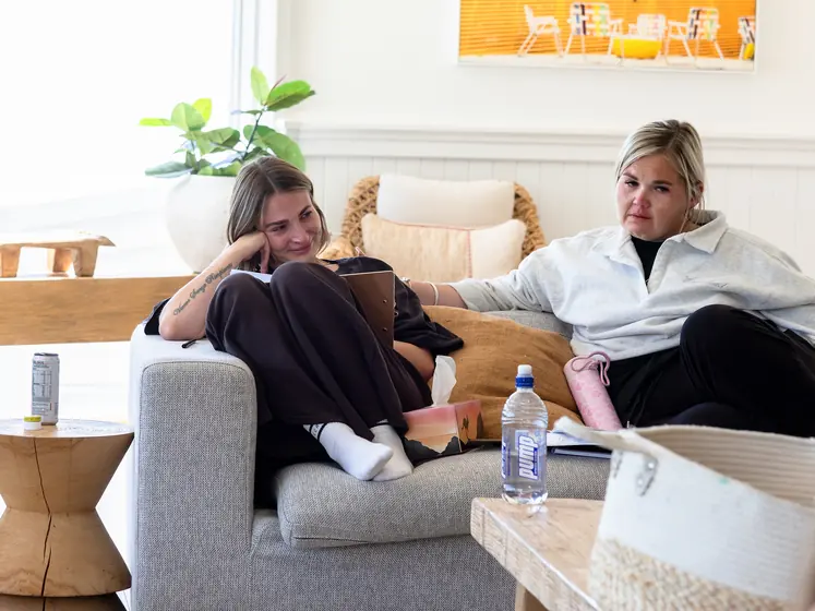 Two guests talking on the sofa